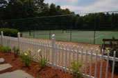 Falmouthport tennis courts with flowers in foreground.