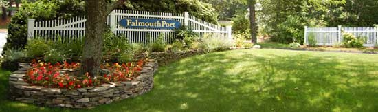 Entrance to FalmouthPort condominiums showing beautiful lawn, colorful flowers and the natural beauty of our corner of Cape Cod.
